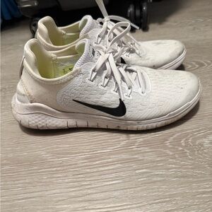 Nike White Sneakers with Black Logo